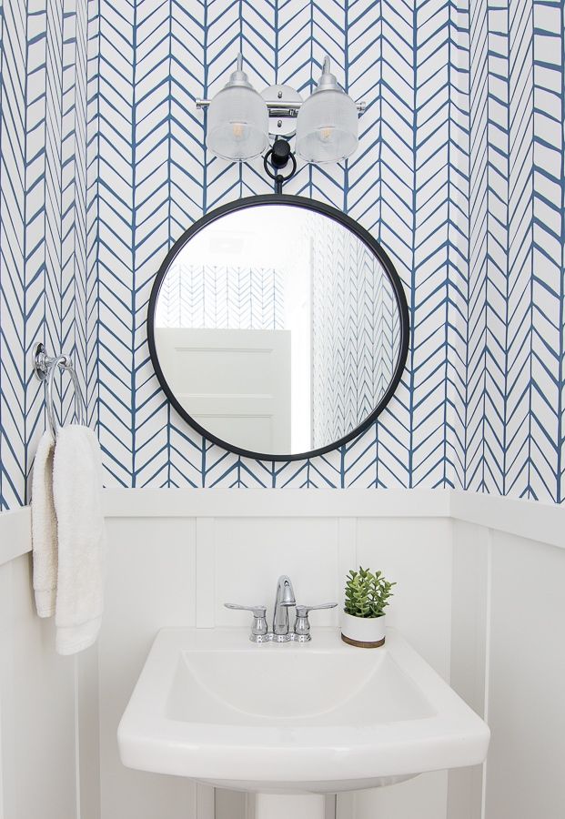 Powder room with blue and white wallpaper