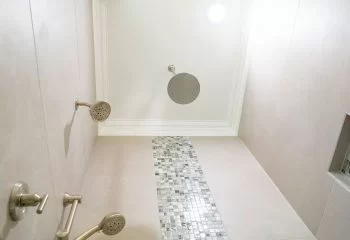 Rain Shower head with mosaic tile work in walk-in shower