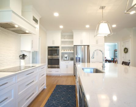 Open floor plan kitchen remodel with classic white and chrome fixture in Morrisville, NC