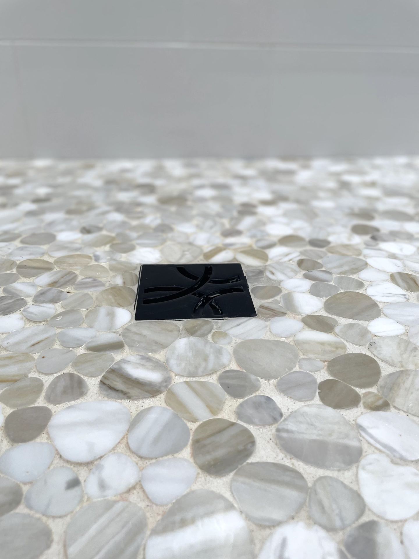 Natural pebble shower floor tile