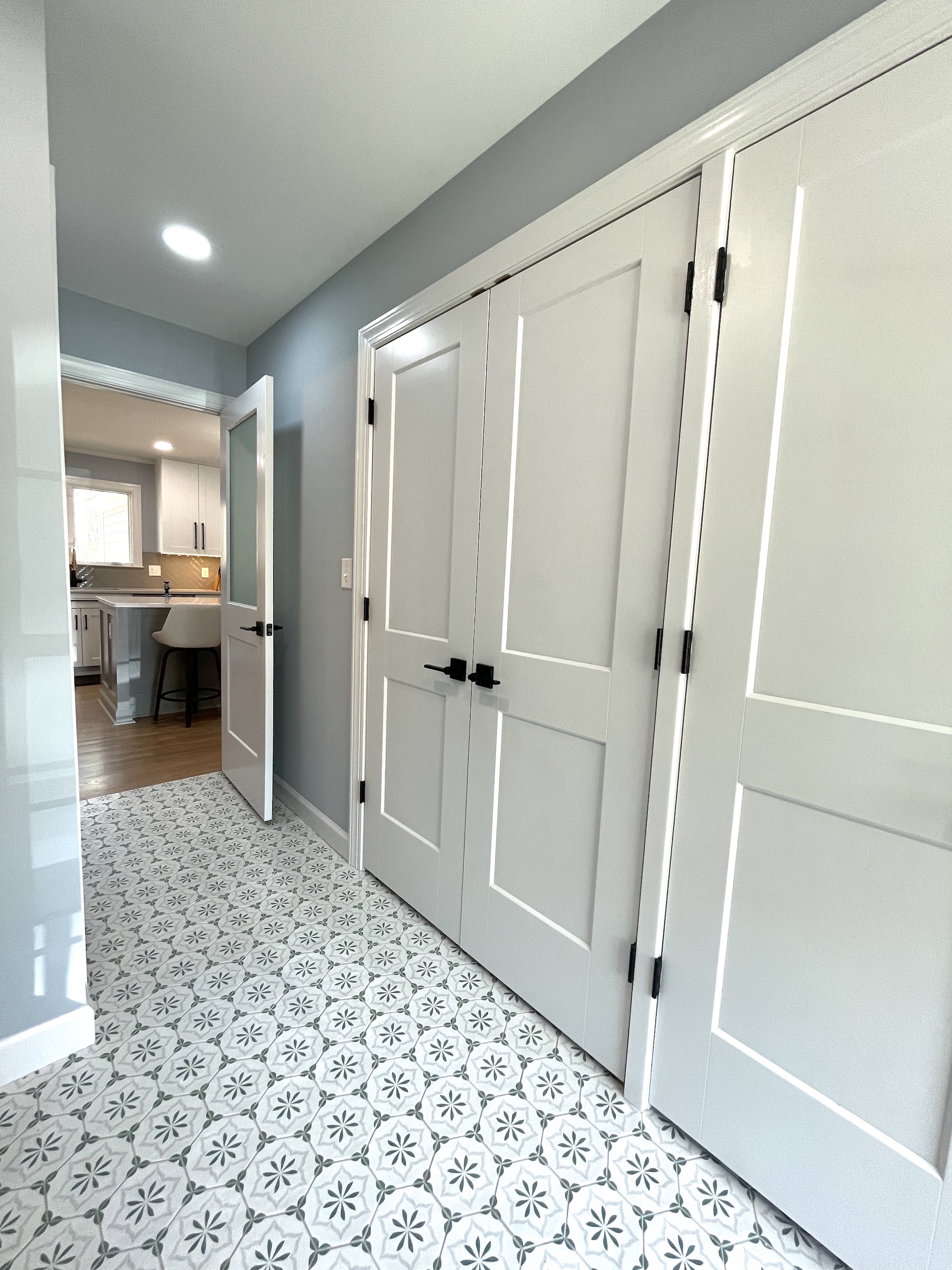 Spacious blue and cream laundry room and power room with tons of store remodel in Cary NC