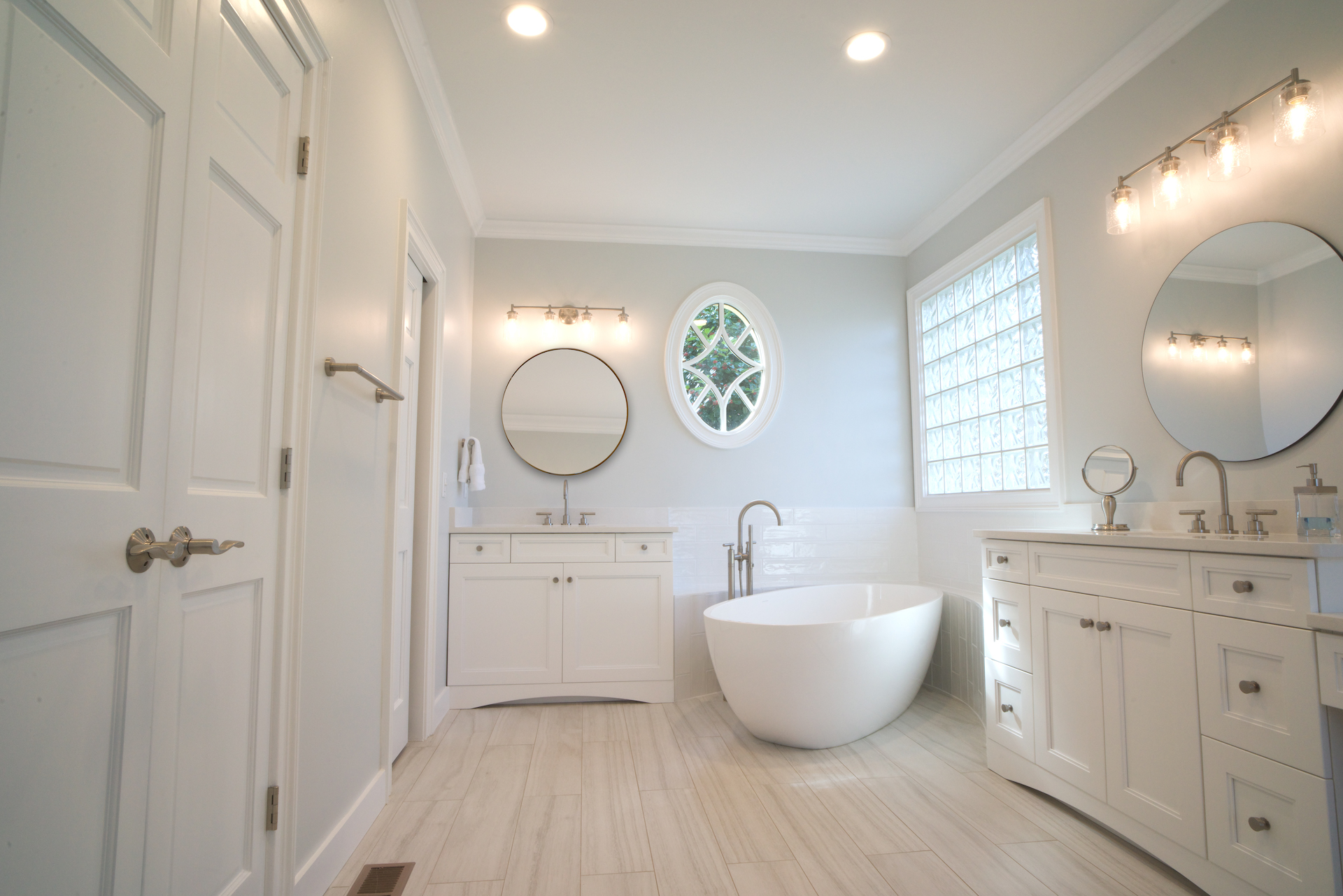 Master bathroom remodel with soaking tub and separate vanities