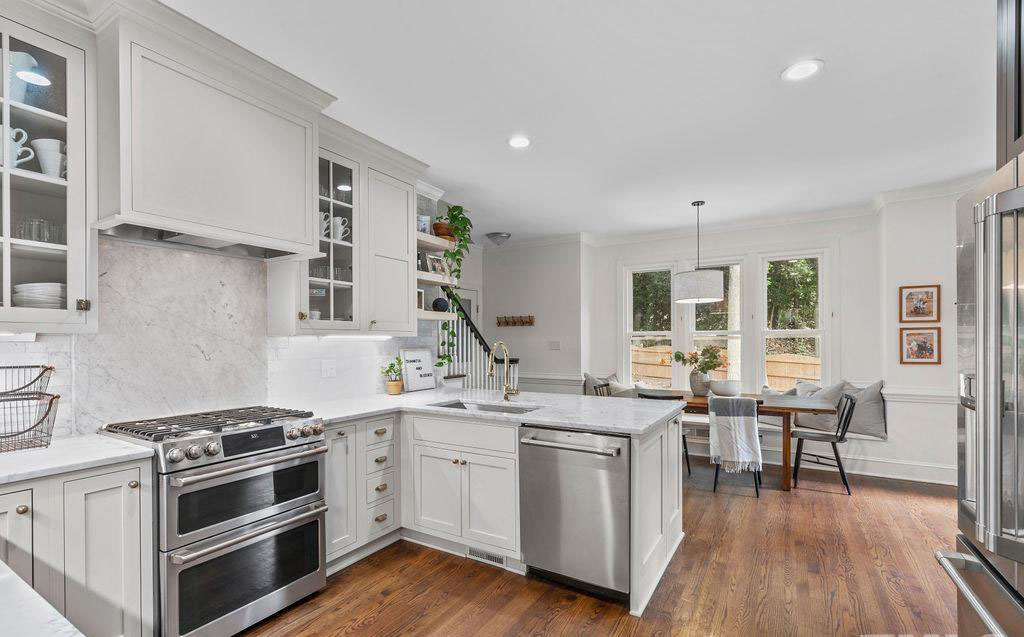 bright gray and white kitchen remodel with U shaped work area