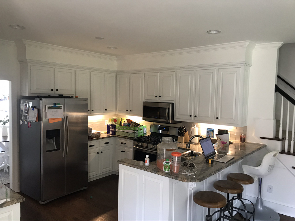 Before kitchen remodel photo that is cramped and not enough storage with items all over the counter.