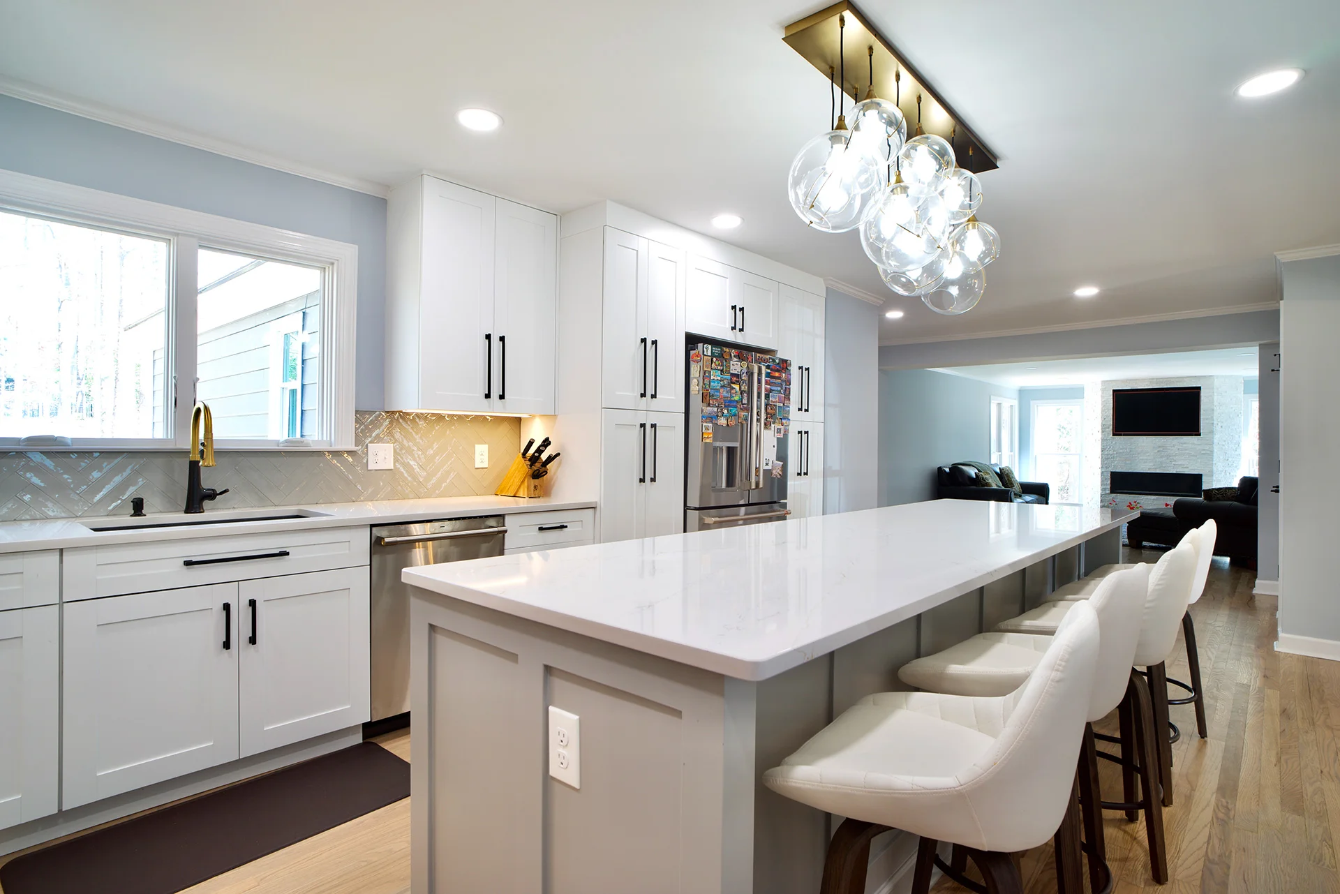 Kitchen island and living room with modern simple fireplace